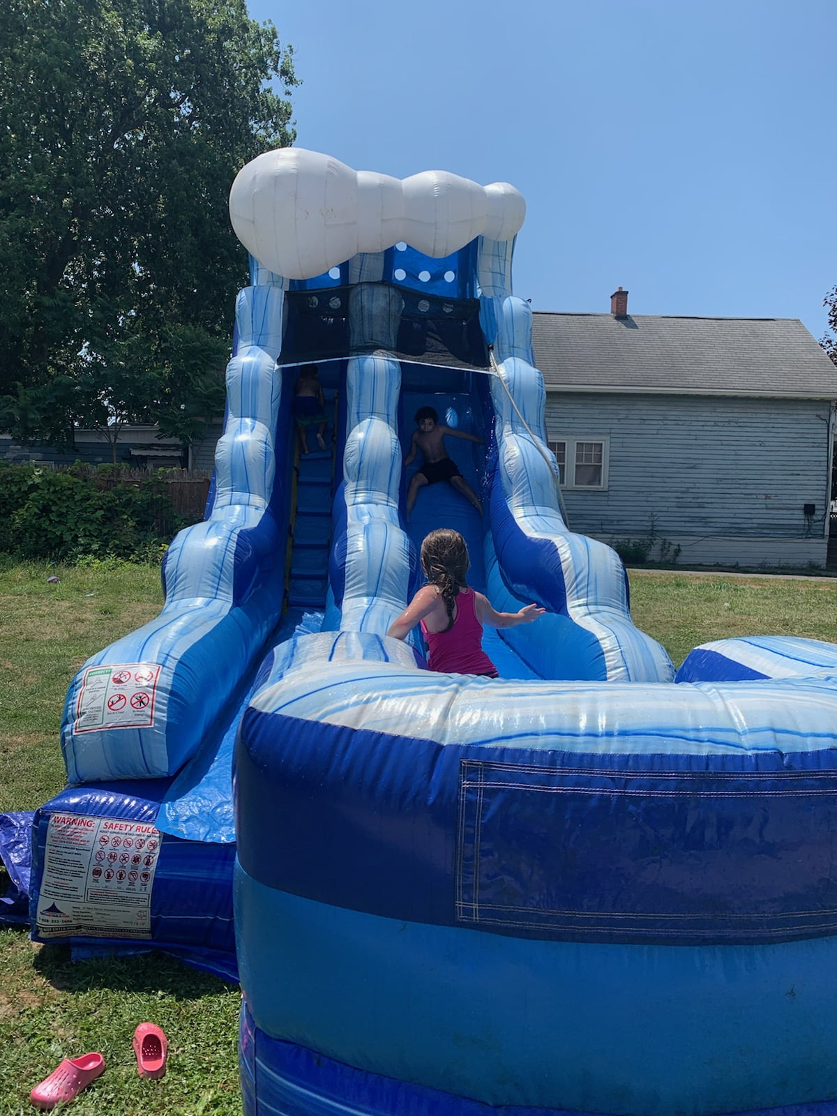 Blue Wave Water Slide at resident backyard