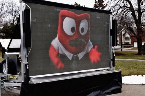 Video LED screen showing a movie during the day 1