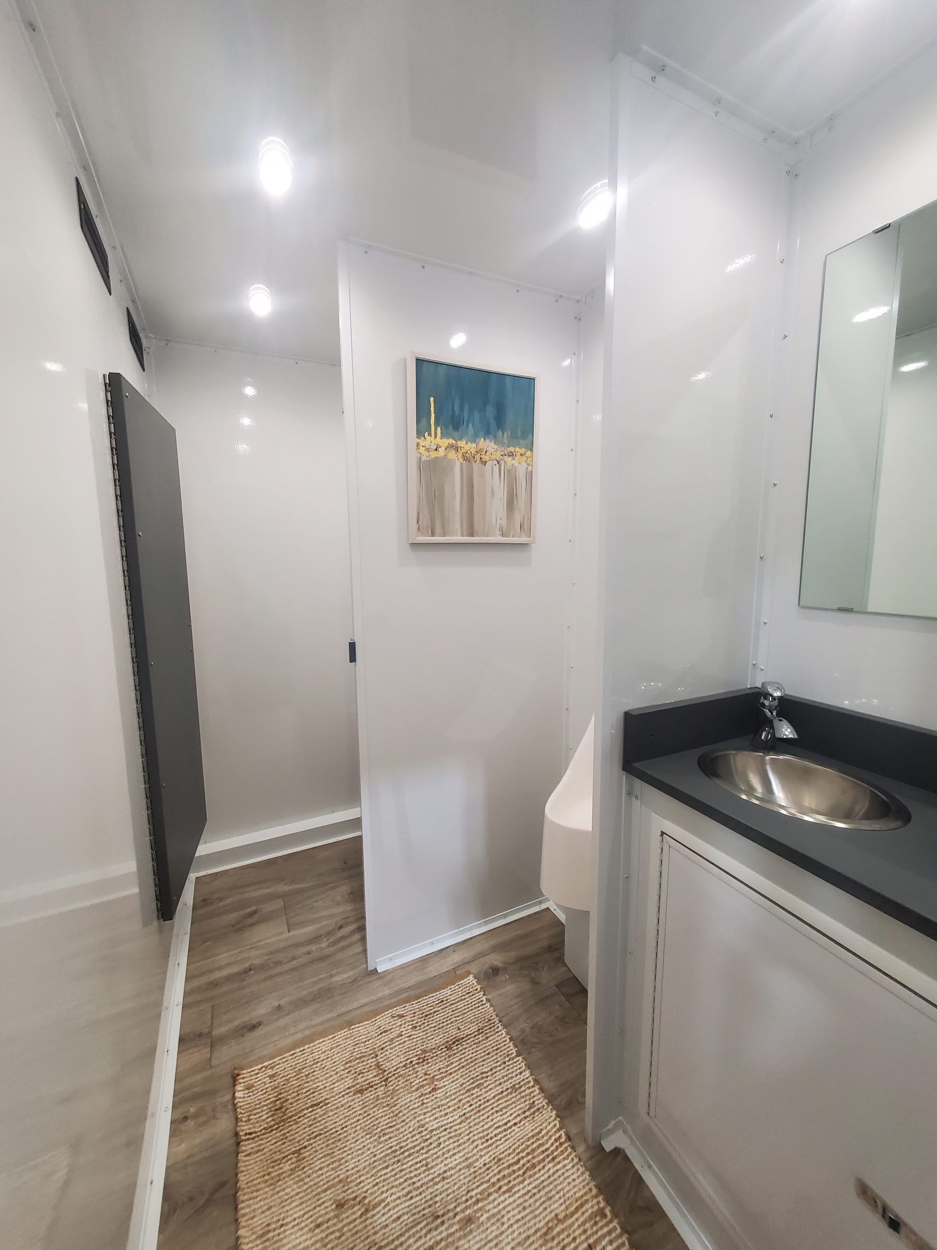 mens side of luxury bathroom trailer scaled